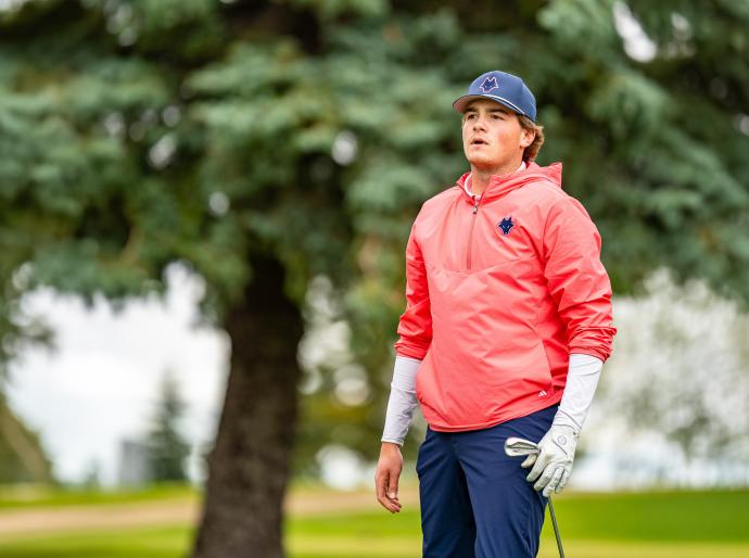 Golfer admiring a shot