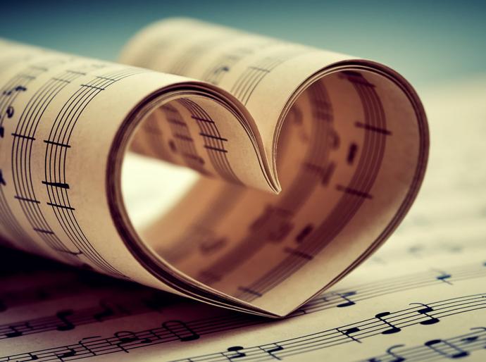 Pages of sheetmusic curled up in the shape of a heart