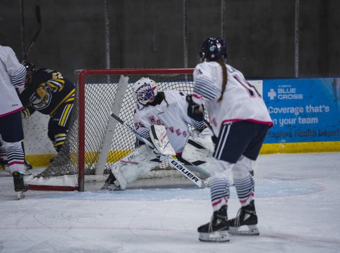 Wolves hockey goalie saves the puck
