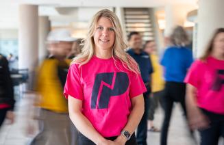 NWP staff member standing in a hero pose