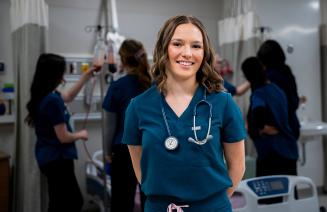 Student nurse posing in the simulation lab