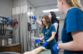 Nursing students training in the simulation lab