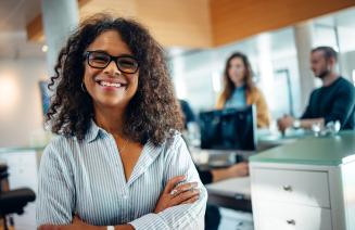 Happy office manager in busy workplace