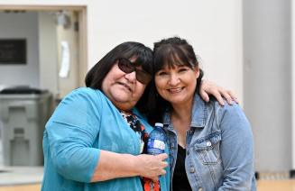 Elder in Residence Theresa Gladue and NWP Financial Aid Advisor Bernie Matlock share an embrace at the Circle of Indigenous Students year end celebration
