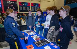 Several attendees talking to a vendor at the NWP Career Fair