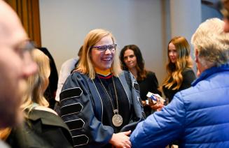 NWP's President and CEO shares a laugh with a guest after her installation ceremony