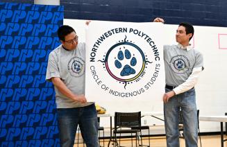 Members of the Circle of Indigenous Students unveiling the group's new logo