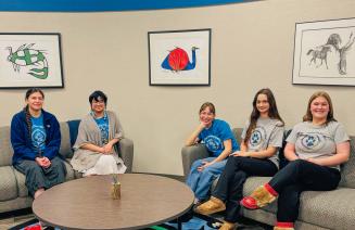Members of the Circle of Indigenous Students visiting in the on-campus friendship centre