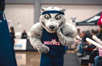 NWP Wolves mascot, Farley in a crowded gym
