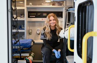 Paramedic sitting in an ambulance