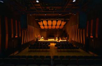 The stage of the recital hall filled with candles set up for the valentines serenade performance