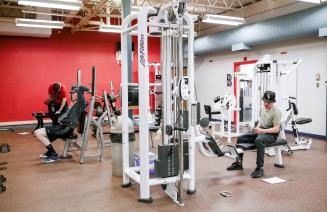 Inside the Fairview fitness centre weight room featuring equipment and weights