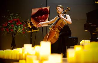 Cellist Katherine Pernal playing cello onstage at the springtime sonata concert