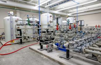 The spartan controls Power Engineering Laboratory featuring water tanks, pipes, and gauges.