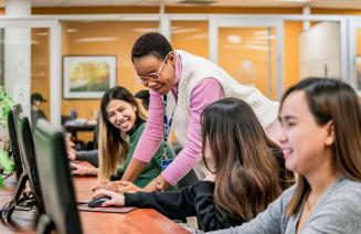 Students receiving help from a learning assistant in the Learning Commons