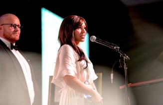 Community Alumni Award recipient, Andrea Deleeuw at the microphone.