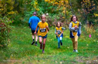 A group of young runners on the trails at the run for the wolves event