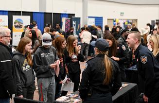 Vendors happily interacting with students at the 2024 Career Fair