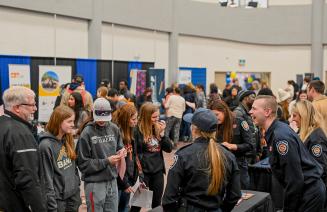 Vendors happily interacting with students at the 2024 Career Fair