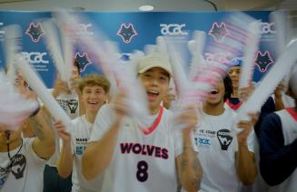 Wolves athletes cheering with noise makers at the Make Some Noise event