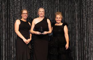 Kim Gravengard, Alumni Leadership Award Recipient flanked by NWP's Board Chair, Shawna Miller, and President and CEO, Vanessa Sheane