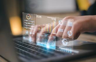 Data analyst working on business analytics dashboard with charts, metrics and KPI to analyze performance and create insight reports for operations management.
