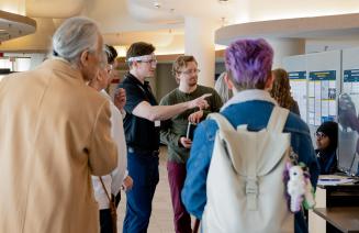Student presenting his research at a student research conference