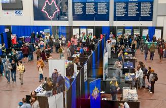 An aerial shot of exibitor booths set up in the main gymnasium