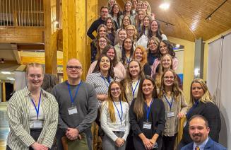 Fall and Winter Semester mentor teachers posing on a staircase