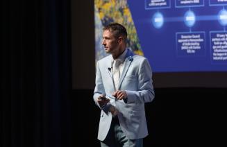 Kyle Reiling delivering a presentation at the Venture AI Conference held at NWP in October 2025