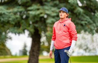 Golfer admiring a shot