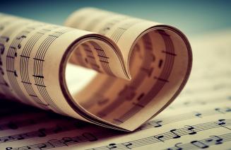 Pages of sheetmusic curled up in the shape of a heart