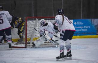 Wolves hockey goalie saves the puck