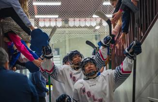 Womens hockey team leaving the ice after the second period of a winning game