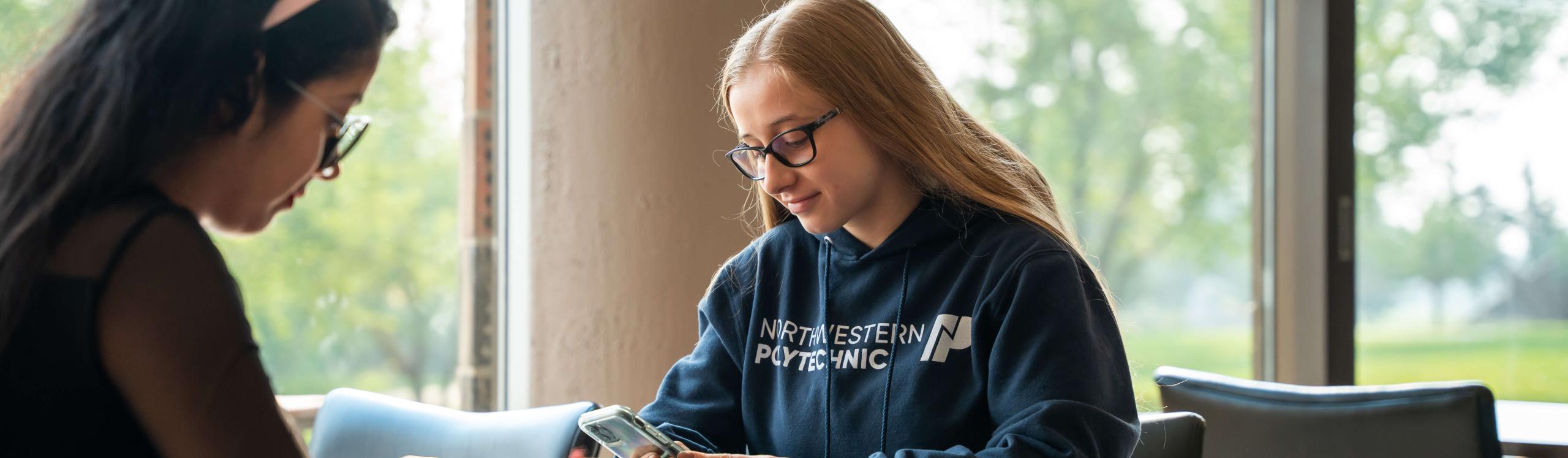 Two students studying on campus