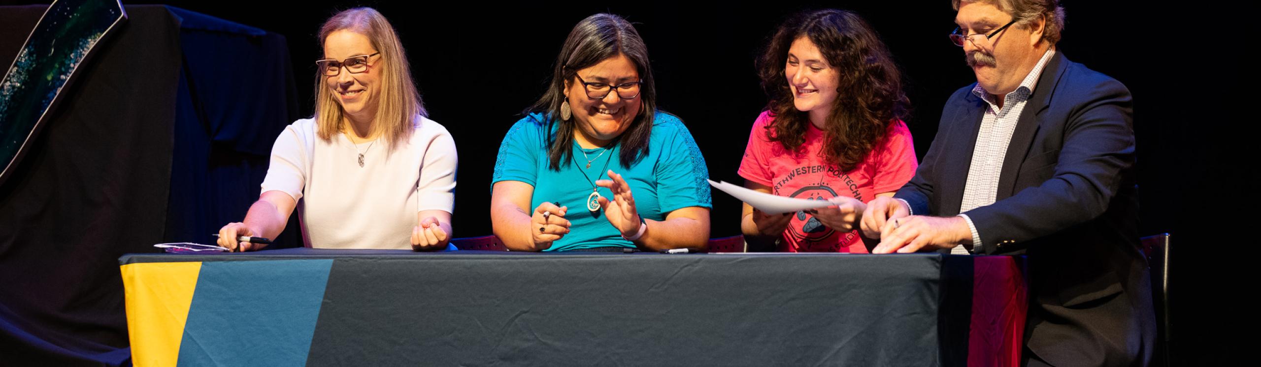 Respresentatives of the institution and Circle of Indigenous students signing the agreement