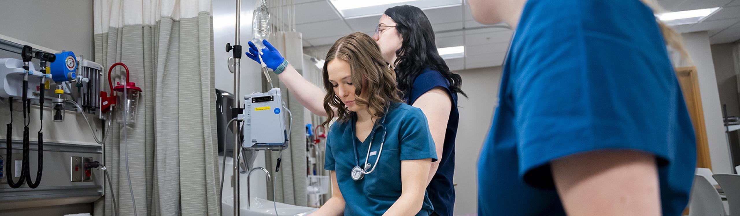 Nursing students training in the simulation lab