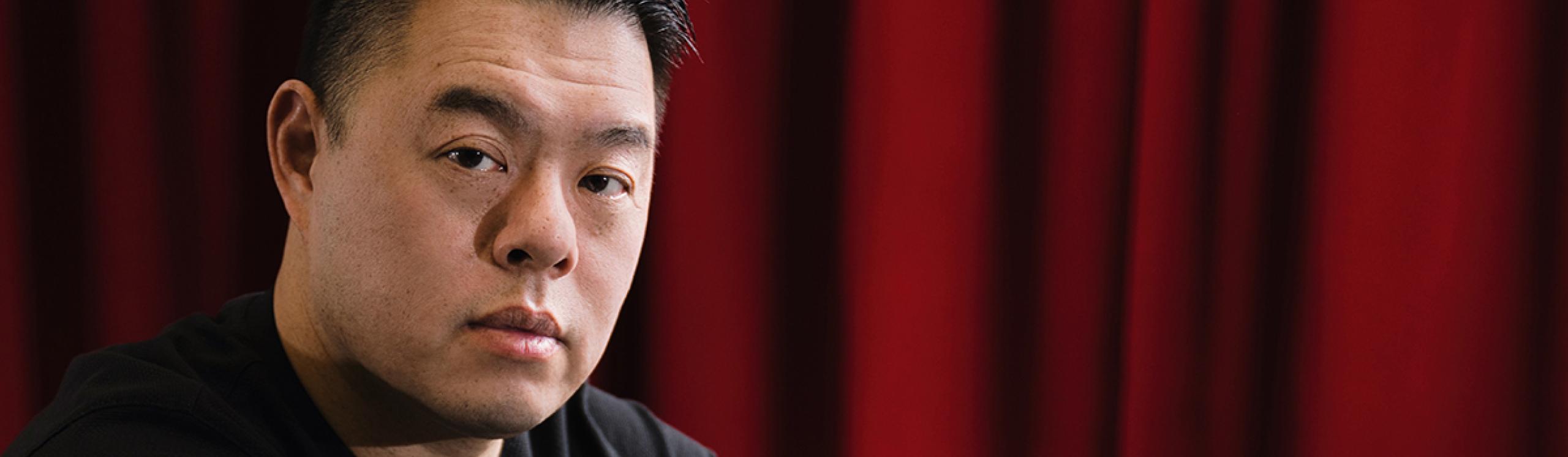 Derek Chiu, classical pianist sitting at a piano