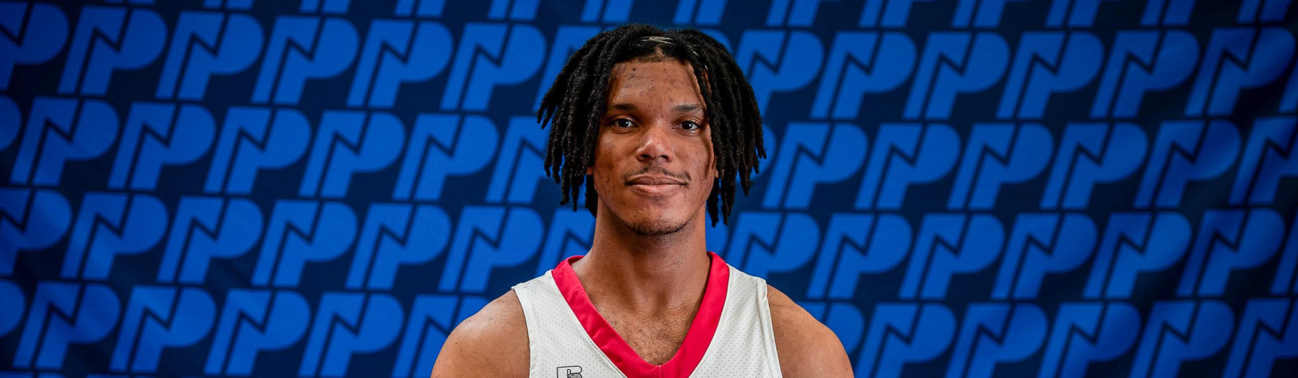 Headshot of Wolves men's basketball player Tony Kibonge