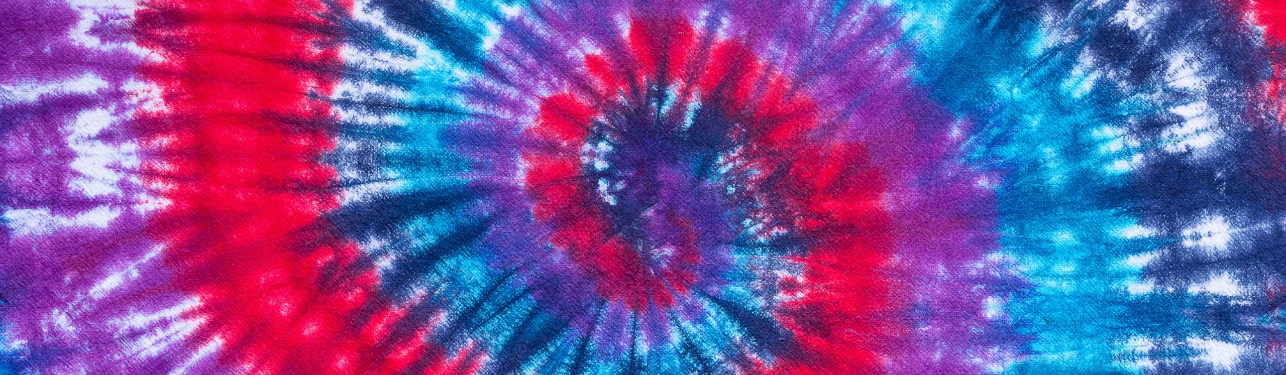 Pink, purple, dark blue and cyan tie dye design