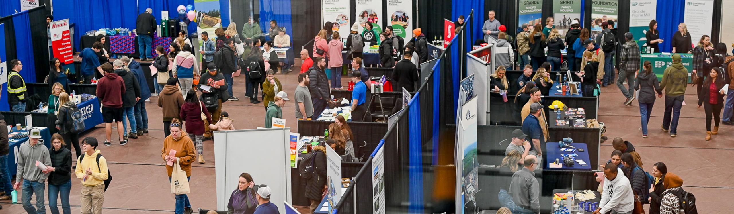 An aerial shot of exibitor booths set up in the main gymnasium