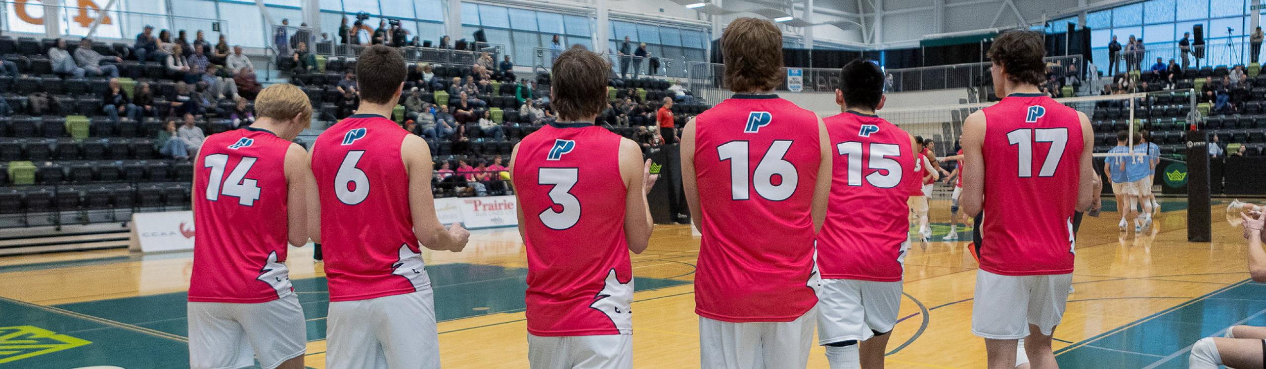 Men's volleyball squad walking onto the court at the 2025-26 ACAC Championship tournament